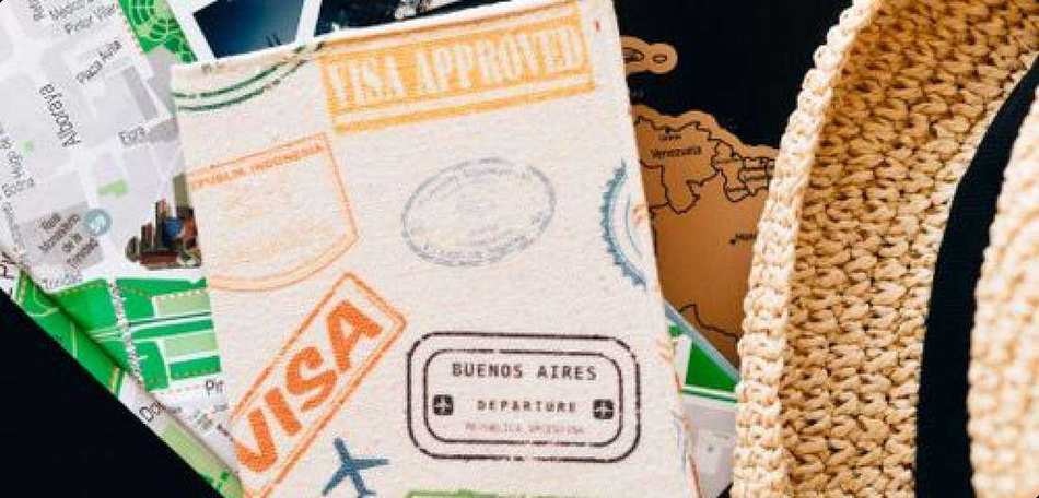 Passport with visa approval stamps and travel documents
